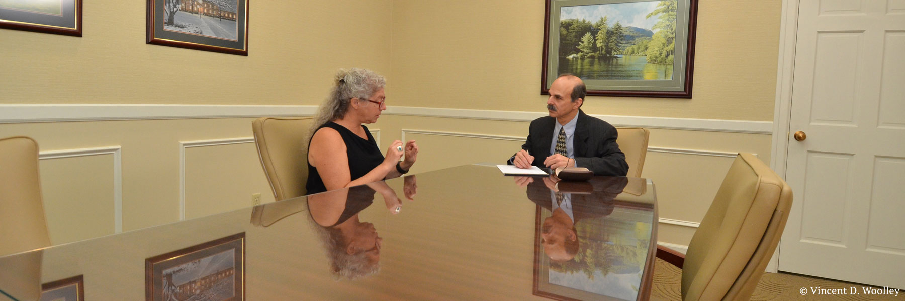 Photograph of Glens Falls, New York attorney Neil Lebowitz in a mock meeting with a client. Copyright owner-licensor: Vincent D. Woolley. Copyright licensee: Neil H. Lebowitz