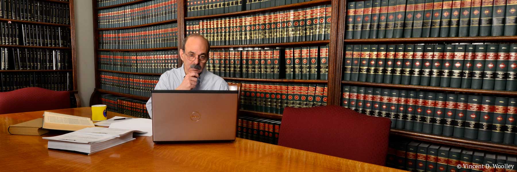 Warren County, New York attorney Neil H. Lebowitz conducting legal research in law library. Photographer: Vincent D. Woolley. Copyright owner-licensor: Vincent D. Woolley. Copyright licensee: Neil H. Lebowitz.